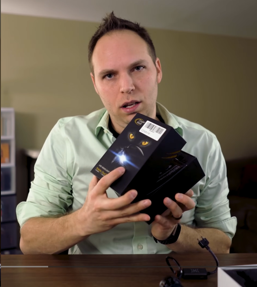 BulbFacts founder reviewing headlight bulb packaging