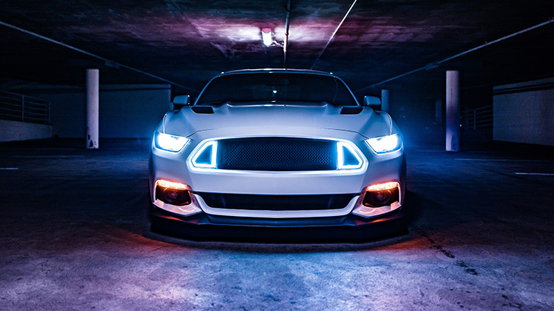 Aftermarket replacement headlights installed on a vehicle