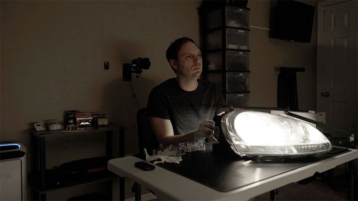 BulbFacts headlight housing test bench with an illuminated headlight
