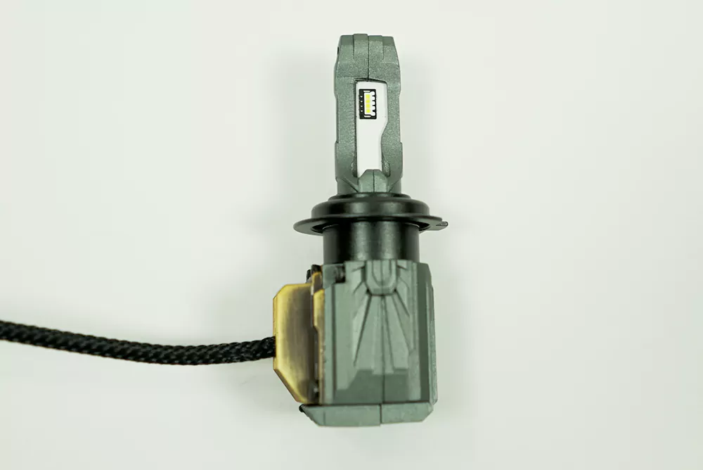 Morimoto 2Stroke 3.0 bulb, emitter board, collar, and cooling housing photographed by BulbFacts